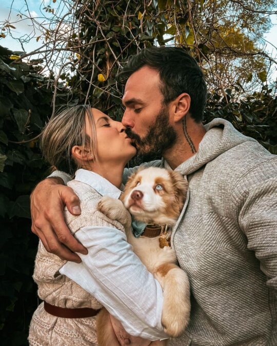 puppy irena locky kissing family pic