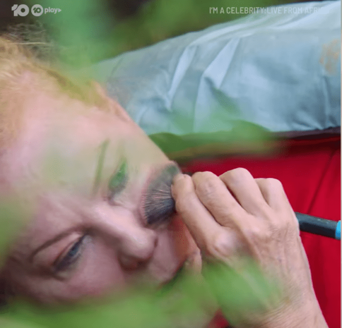 Kerri-Anne applying makeup